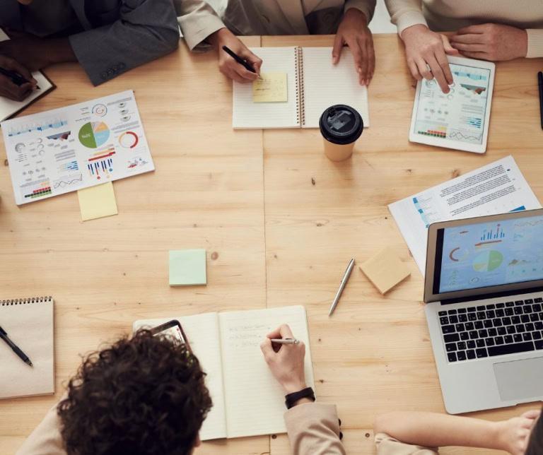 Data-driven marketing strategy meeting with team reviewing analytics and automation tools.